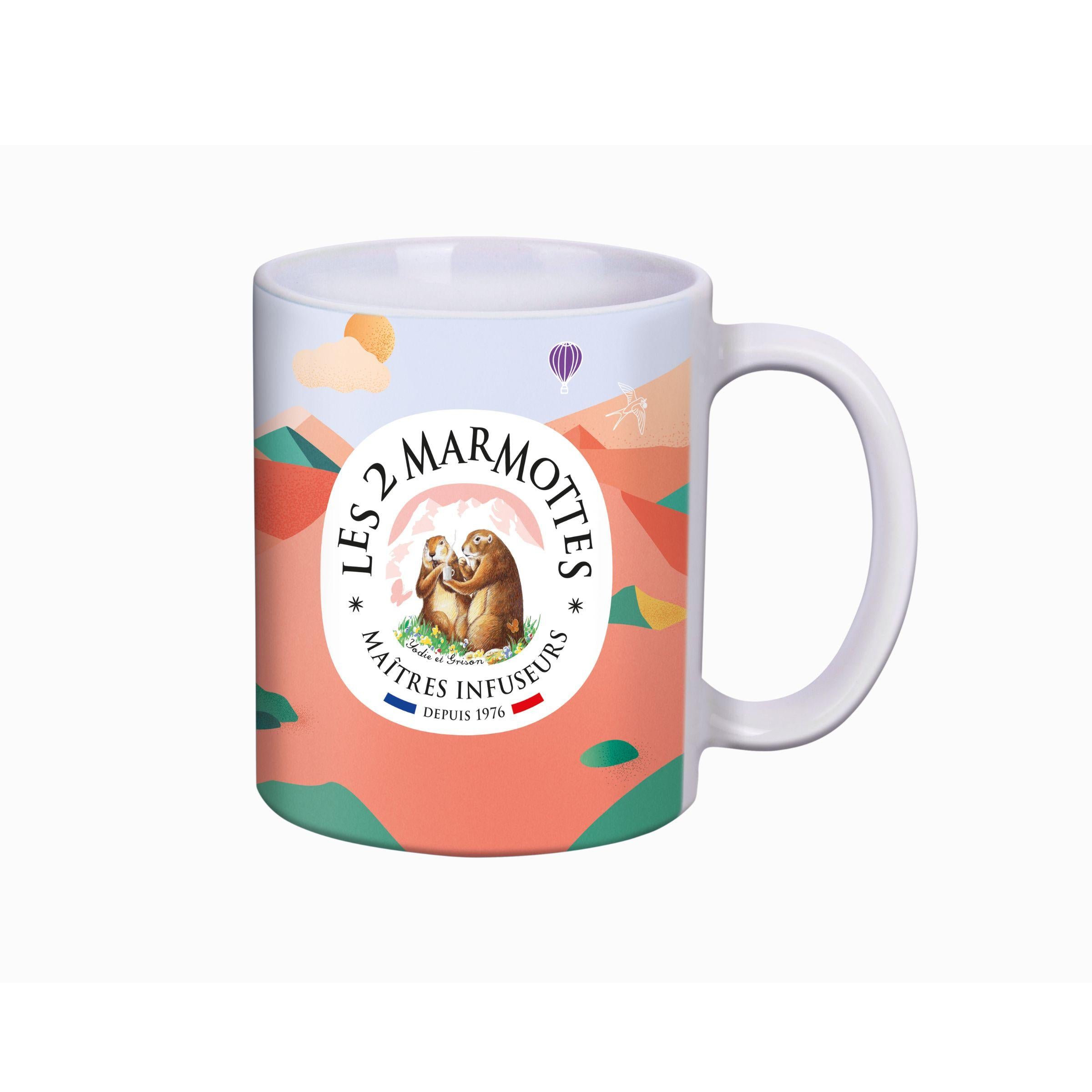 Mug rose à décor de montagne et marmotte relax avec citation "ma plus belle histoire de mug c'est toi" + logo les 2 marmottes au dos