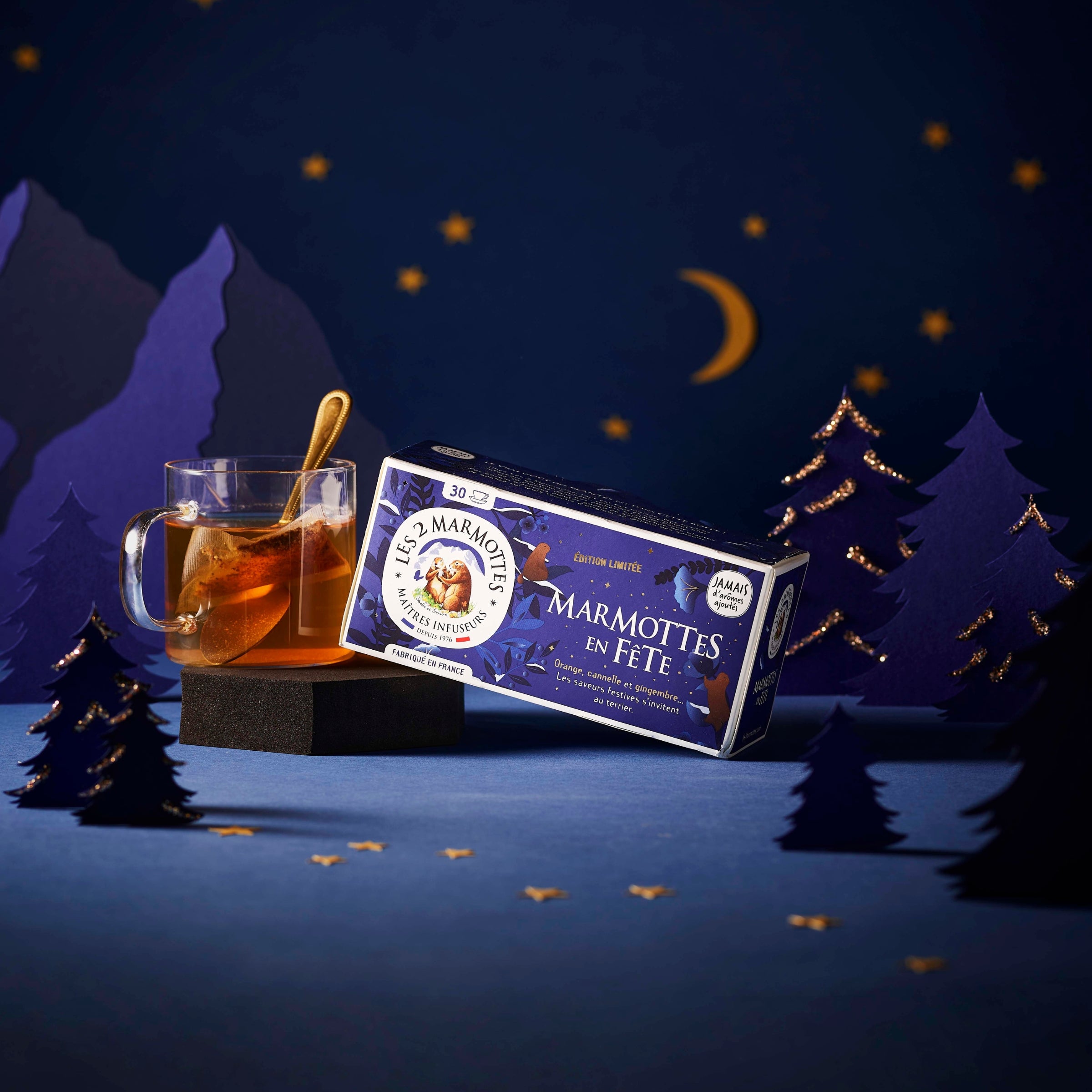 Tisane de Noël Marmottes en Fête : tisane orange, cannelle, gingembre, saveurs authentiques sans arômes ajoutés. Idée cadeau Noel Secret Santa pour fans d'infusions.